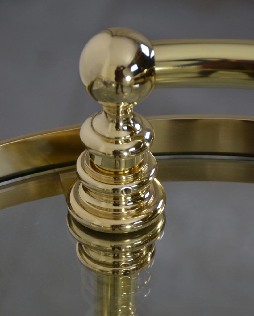 A custom made polished brass champagne trolley