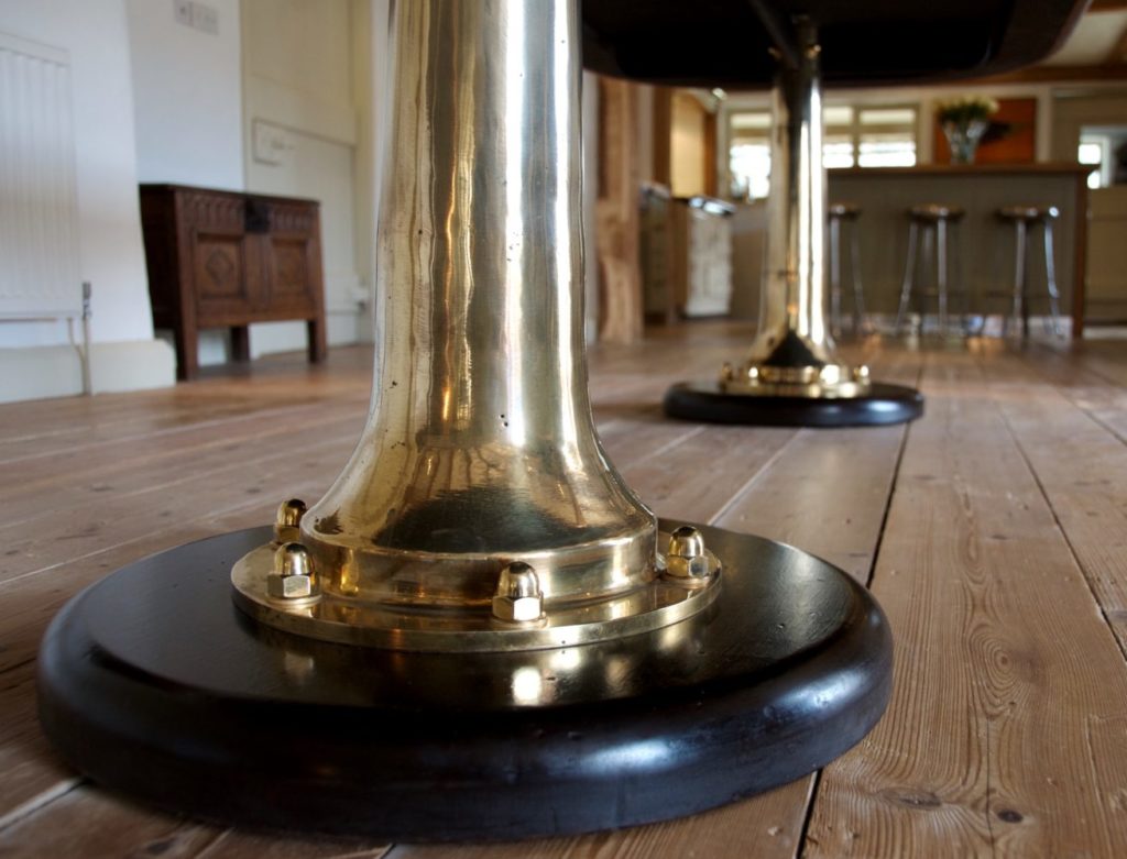 Bespoke marine style copper dining table with ship telegraph legs