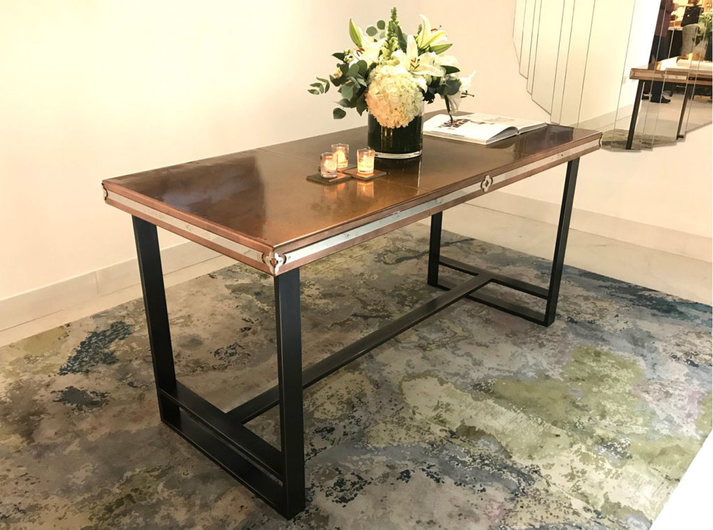 Custom made antique copper top table featured at Christopher Peacock London showroom Design Centre Chelsea Harbour