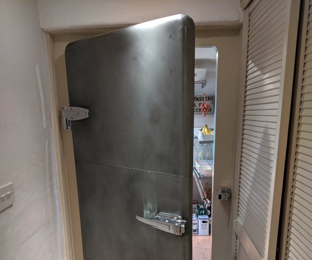 Bespoke made zinc clad door in the style of retro 1940s fridge